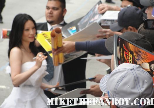 lucy liu signing autographs for fans kung fu panda  premiere hot sexy photo shoot promo poster mini one sheet rare movie signed autograph rare promo mini poster on the carpet at the kung fu panda 2 signing autographs at the los angeles premiere rare mini poster