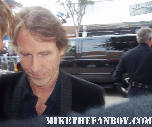 michael bay the multi talented director of transformers stops to sign autographs for fans at the super 8 premiere in westwood