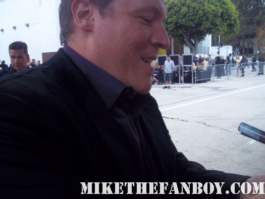 jon favreau from iron man signing autographs for fans at the super 8 movie premiere in westwood ca director