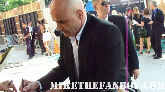 bas rutten signs autographs for fans at the zookeeper premiere in westwood ca rare promo ufc fighter hot shirtless promo signed 