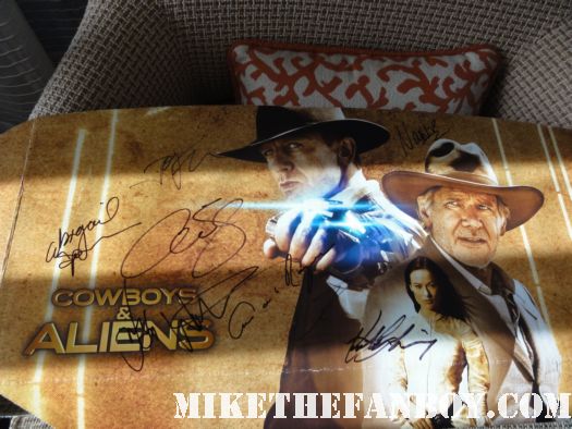 sign and banner of premiere harrison ford signing autographs at the Premiere party red carpet at the cowboys and aliens world movie premiere san diego ca comic con 2011