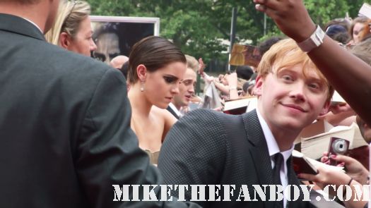 rupert grint emma watson and tom felton sign autographs at the the harry potter and the deathly hallows part 2 new york movie premiere waiting fans for the red carpet daniel radcliffe