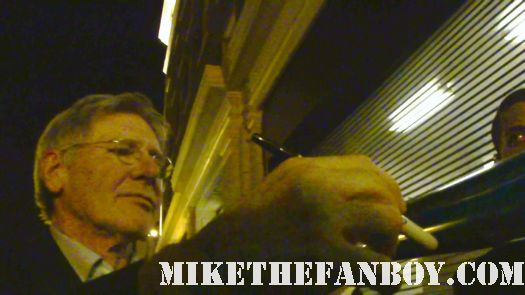 harrison ford signing autographs at the Premiere party red carpet at the cowboys and aliens world movie premiere san diego ca comic con 2011