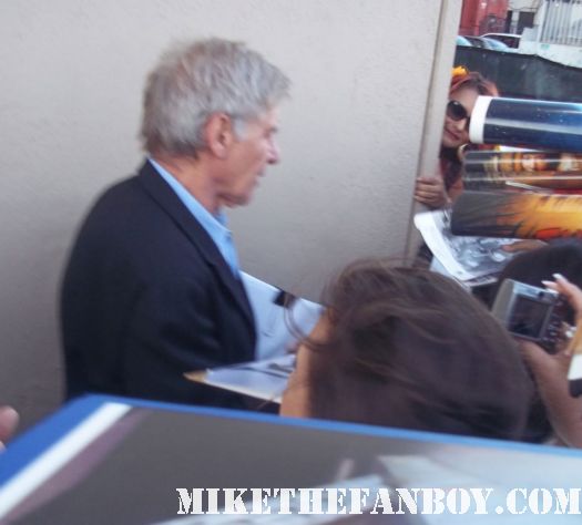 Indiana Jones star Mr. Harrison Ford stops to sign autographs for waiting fans at a television talk show cowboys and aliens