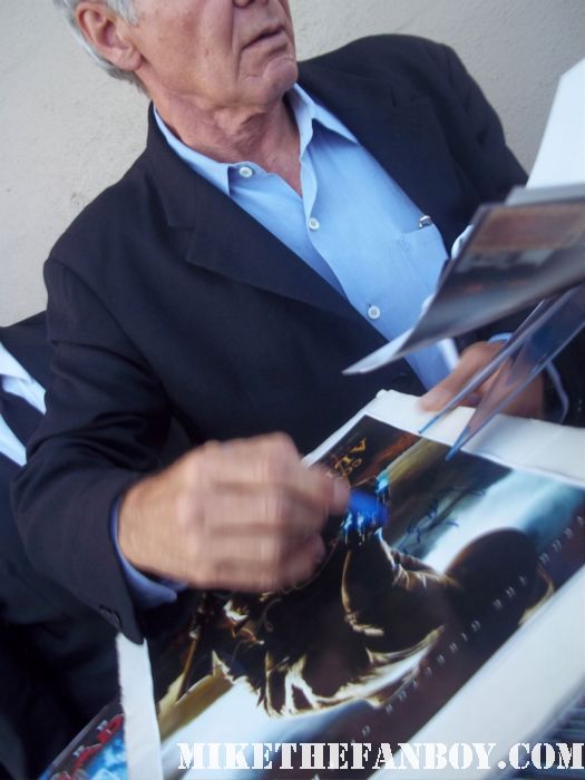 Indiana Jones star Mr. Harrison Ford stops to sign autographs for waiting fans at a television talk show cowboys and aliens