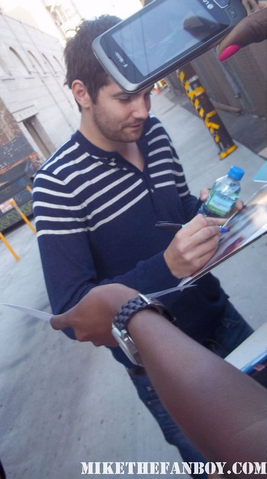 jim sturgess from 21 and across the universe stops to sign autographs for fans while out promoting one day with anne hathaway sexy hot shirtless signature promo rare hot photoshoot photo damn fine