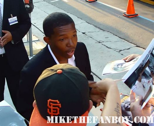 denzel whitaker signing autographs at the warrior premiere in hollywood  the lights going out at the red carpet at the warrior premiere in hollywood the warrior premiere in hollywood the warrior world movie premiere with Tom hardy joel edgerton rare hot sexy promo red carpet photo bane dark knight rises
