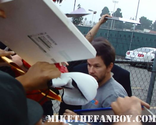 Marky Mark wahlberg arrives at a talk show taping to promote boardwalk empire and signs autographs for fans hot and sexy mark wahlberg good vibrations signed autograph hot sexy rare promo