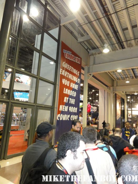 a crowd of people waiting to get into new york comic con 2011 rare promo hot sweaty costumed fans nycc 2011