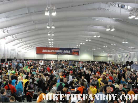 a crowd of people waiting to get into new york comic con 2011 rare promo hot sweaty costumed fans