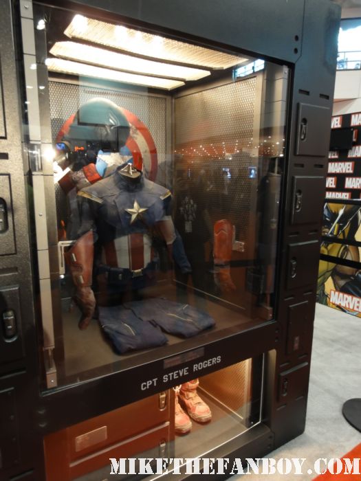 captain america prop and costume display at nycc 2011 new york comic con the avengers marvel booth at new york comic con 2011 nycc lifesize transformers optimous prime statue NYCC New York comic con sold out sign a crowd of people waiting to get into new york comic con 2011 rare promo hot sweaty costumed fans