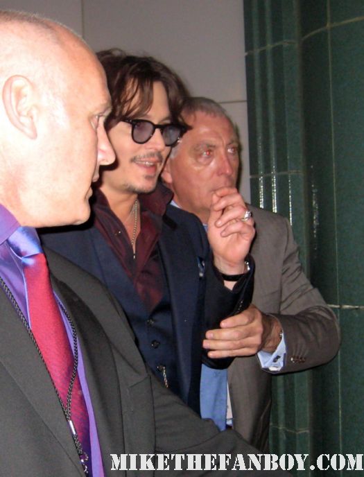 johnny depp arriving to the rum diary world movie premiere the red carpet or black carpet at the rum diary world movie premiere with johnny depp signing autographs for the fans! sexy hot rare