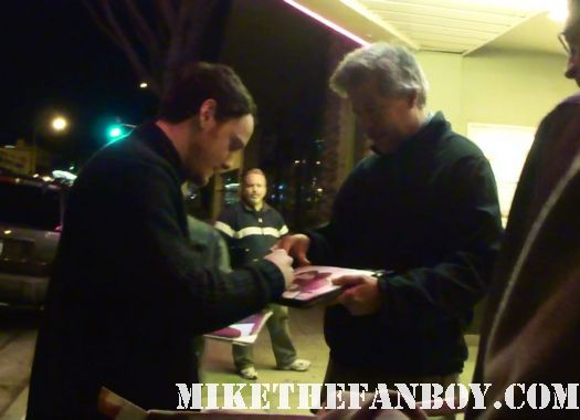 anton yelchin signing autographs for fans before  at a q and a with felicity jones at the aero theater in santa monica ca