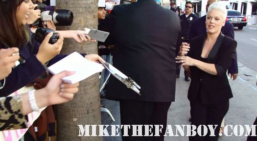 Pink-or-Pnk-signing-autographs-for-fans-at-the-happy-feet-two-premiere to at the The Happy Feet Two World Movie Premiere! Pink... Or P!NK ! Robin Williams! Sofia Vergara! Hank Azaria! Elijah Wood!
