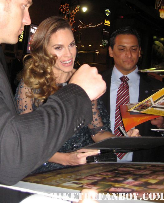 Hilary Swank arrives the new years eve world movie premiere and signs autographs for fans