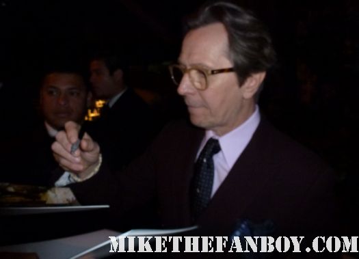 gary oldman signing autographs tinker tailor soldier spy movie poster  tinker tailor soldier spy world movie premiere red carpet with mark strong colin firth and gary oldman