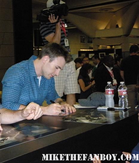 chris evans and hugo weaving signing autographs at the marvel booth at san diego comic con 2011 