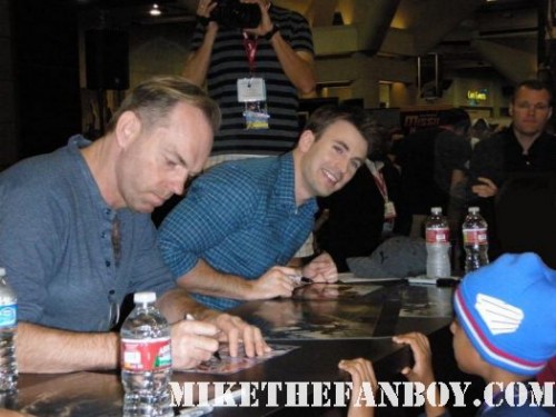 chris evans and hugo weaving signing autographs at the marvel booth at san diego comic con 2011