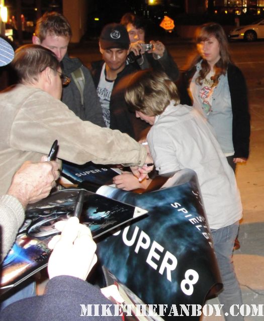 ryan lee signing autographs for fans outside a screening of super 8 at the aero theatre in santa monica