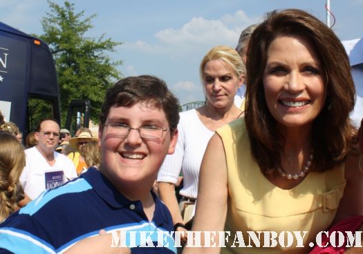 Michele Bachmann poses for a fan photo with dallas at a rally for her failed presidential bid signed autograph