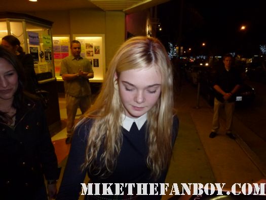 elle fanning from super 8 and we bought a zoo signing autographs for fans outside a screening in santa monica looking awesome