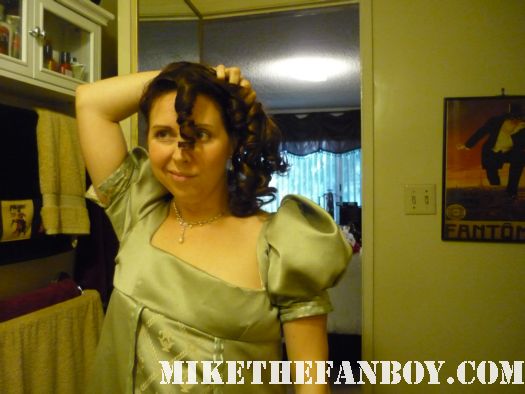Side ponytail the novel strumpet from mike the fanboy putting on a tam preparing to go to the jane austin ball in los angeles put on by the Society for Manners and Merriment in the district of Los Angeles known as Pasadena