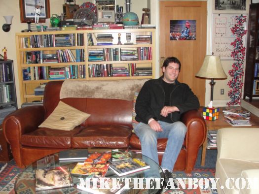 on the set of The Big Bang Theory in sheldon and Leonard's couch in the living room on the set rare promo hot mike the fanboy the big bang theory behind the scenes
