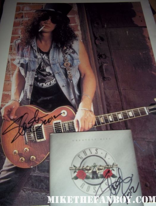 slash signed autograph guns n roses cd rare promo photo Guns n roses star and lengend slash signs autographs for fans after an outdoor concert rare promo hot musician