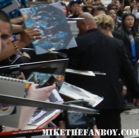 sexy scarlett johansson black widow  signs autographs for fans at the avengers world movie premiere on the red carpet with chris hemsworth chris evans samuel l jackson and more