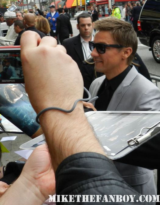 jeremy renner hawkeye sexy signs autographs for fans at the avengers world movie premiere on the red carpet with chris hemsworth chris evans samuel l jackson and more