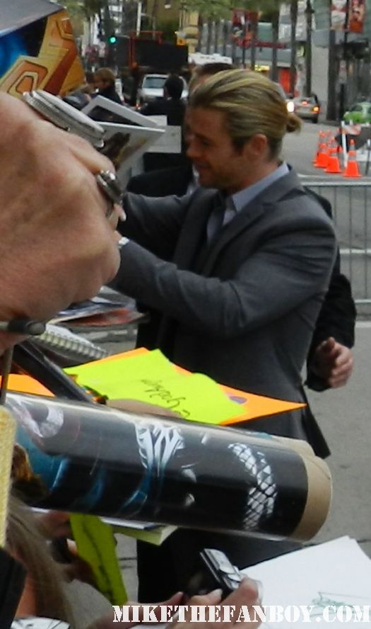 sexy chris hemsworth thor signs autographs for fans at the avengers world movie premiere on the red carpet with chris hemsworth chris evans samuel l jackson and more