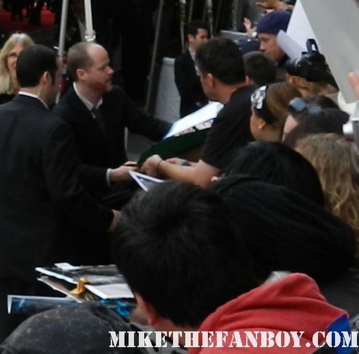 buffy the vampire slayer creator joss whedon signs autographs for fans at the avengers world movie premiere on the red carpet with chris hemsworth chris evans samuel l jackson and more