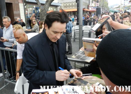 john cusack signing autographs at his walk of fame star ceremony in hollywood john cusack giving a press interview at his walk of fame star ceremony on hollywood blvd. 