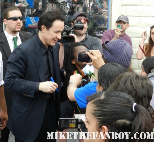 john cusack signing autographs at his walk of fame star ceremony in hollywood john cusack giving a press interview at his walk of fame star ceremony on hollywood blvd. 