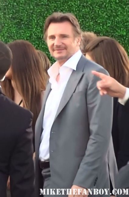 liam neeson arrives at the premiere of Battleship in los angeles and does not sign autographs for fans