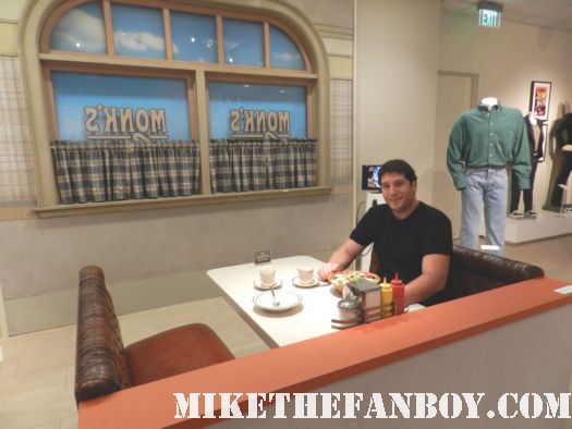 mike the fanboy at the recreation of monk's diner from Seinfeld at the paley center out of the box prop and costume display