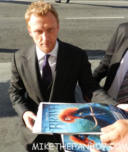 kevin mckidd signing autographs for fans at the world premiere of brave in hollywoodbag pipe players at walt disney's world premiere of brave pixar rare red carpet scottish animated classic  