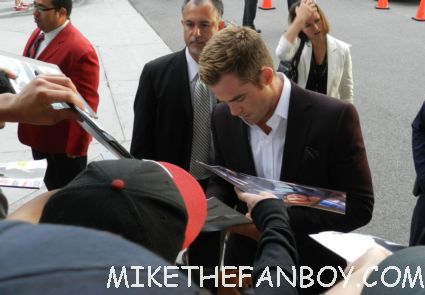 sexy chris pine signing autographs at  the world premiere of people like us world movie premiere at the la film festival in downtown los angeles michelle pfeiffer chris pine elizabeth banks