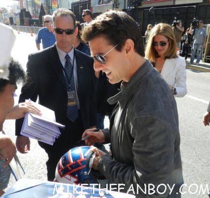 tom cruise signing autographs for fans looking hot and sexy at the rock of ages world movie premiere