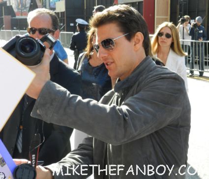 tom cruise signing autographs for fans looking hot and sexy at the rock of ages world movie premiere