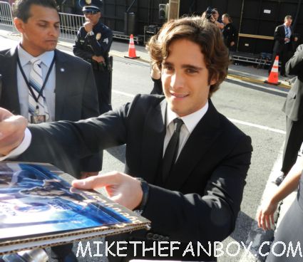 sexy Diego Boneta signing autographs for fans looking hot and sexy at the rock of ages world movie premiere
