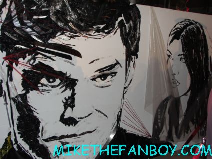 the dexter mural at san diego comic con made out of knives and garbage bags at the showtime party at san diego comic con 2012