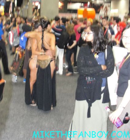 two naked slave leia's posing on the convention floor at san diego comic con sdcc 2012