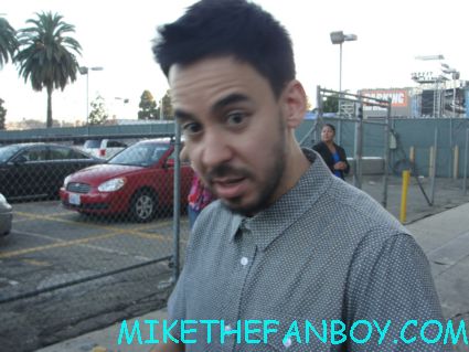 Mike Shinoda from lincoln park signs autographs for fans outside jimmy kimmel live