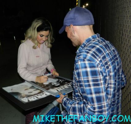 marina and the diamonds signing autographs for fans Marina Lambrini Diamandis welsh singer songwriter signing a rare promo poster autograph