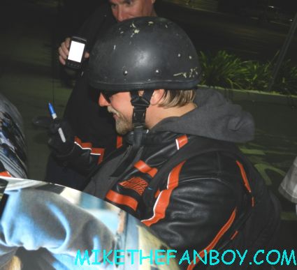 sons of anarchy star charlie hunnam signing autographs for fans outside the set of sons of anarchy on the set of sons of anarchy waiting for Charlie hunnam to finish and sign autographs for fans