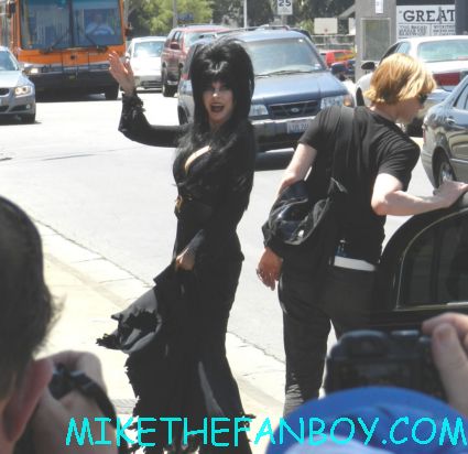 elvira arriving in front of golden apple comics to sign autographs for fans looking hot and sexy elvira mistress of the dark