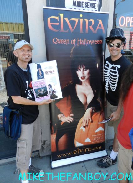 scotty and scott posing in front of the elvira banner scott douglas moore waiting for elvira to sign his dvd at the golden apple comics in los angeles