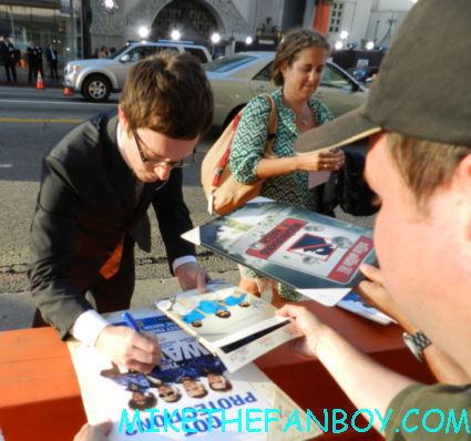 Akiva Schaffer signing autographs at the world premiere of the watch at the chinese theatre in hollywood