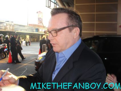 tom arnold signing autographs for fans on the red carpet for the film hit and run